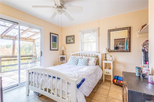 bedroom with access to exterior and ceiling fan