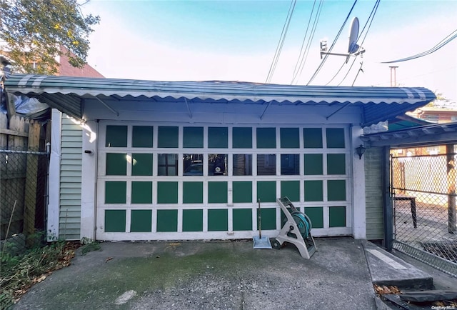 exterior space with a garage and an outdoor structure