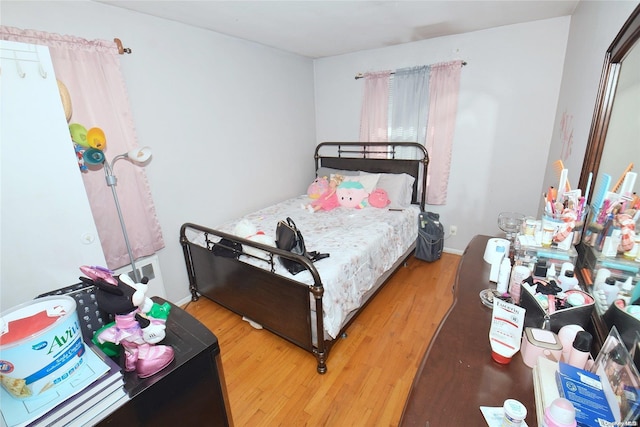 bedroom featuring wood-type flooring