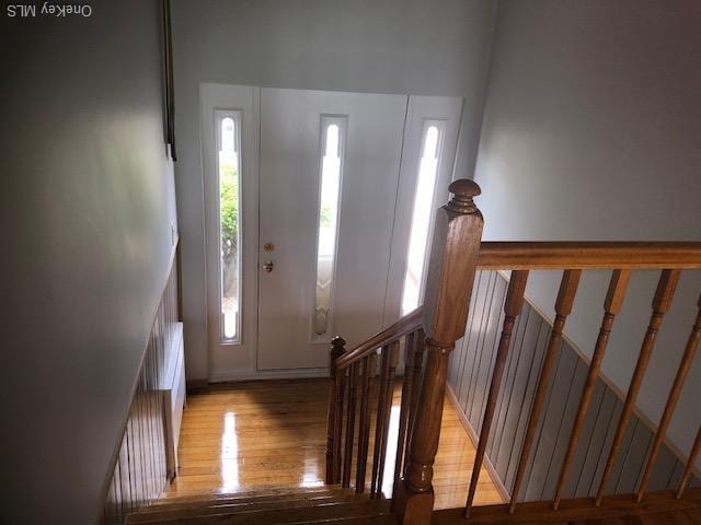 69 E 1st St, Freeport, NY 11520 - foyer featuring light wood-style flooring and stairs