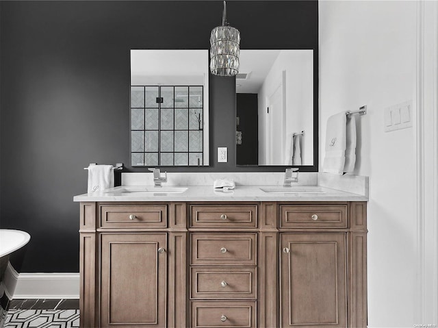 bathroom featuring vanity and a notable chandelier