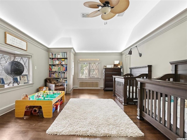 38 Royal Ct, Rockville Centre, NY 11570 - bedroom with vaulted ceiling, dark wood finished floors, a crib, and crown molding