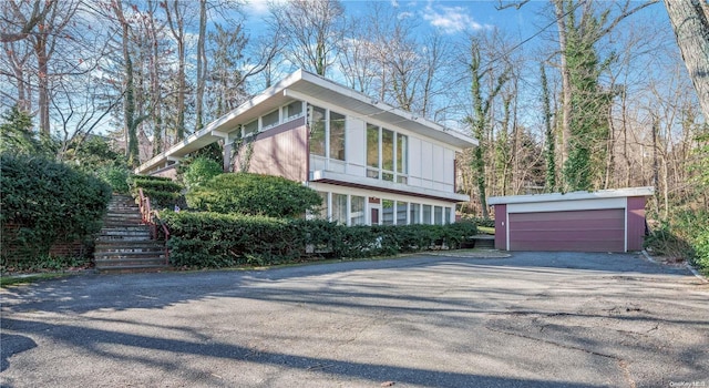 view of front of house with an outbuilding and a garage