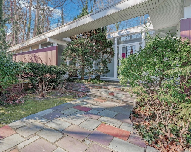 doorway to property featuring a patio area