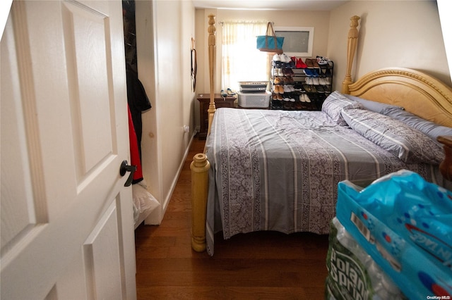 bedroom featuring dark hardwood / wood-style floors