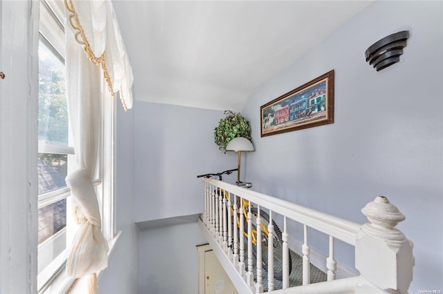 corridor featuring vaulted ceiling