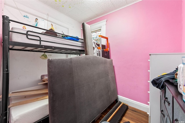 bedroom featuring wood-type flooring