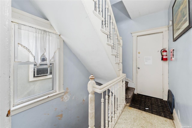 entryway with cooling unit and lofted ceiling