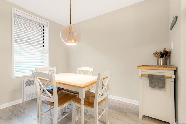 dining room with light hardwood / wood-style floors