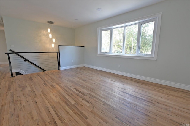 unfurnished room featuring light hardwood / wood-style flooring