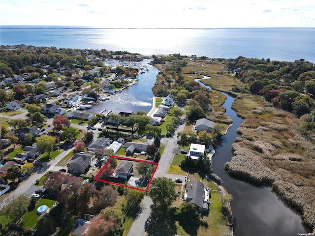 39 Roosevelt Blvd, East Patchogue, NY 11772 - aerial view of property and surrounding area with a large body of water, property parcel outlined, and nearby suburban area