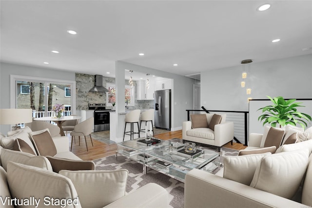 39 Roosevelt Blvd, East Patchogue, NY 11772 - living room featuring recessed lighting and light wood finished floors
