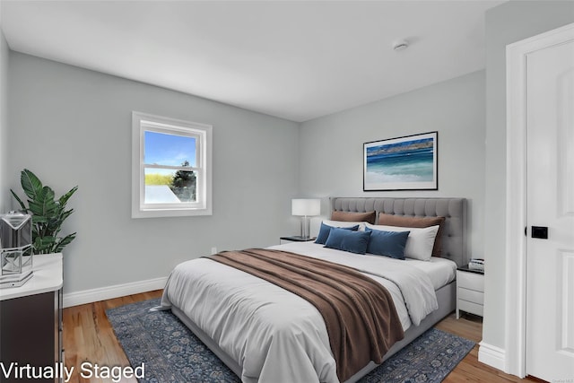 39 Roosevelt Blvd, East Patchogue, NY 11772 - bedroom with light wood-style floors and baseboards