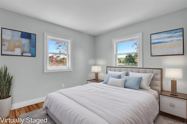39 Roosevelt Blvd, East Patchogue, NY 11772 - bedroom with wood finished floors and baseboards