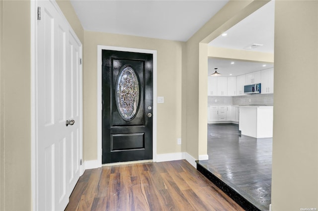 foyer entrance featuring dark hardwood / wood-style flooring