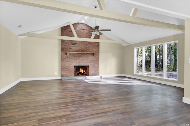 unfurnished living room featuring dark wood-type flooring, high vaulted ceiling, ceiling fan, a fireplace, and beamed ceiling