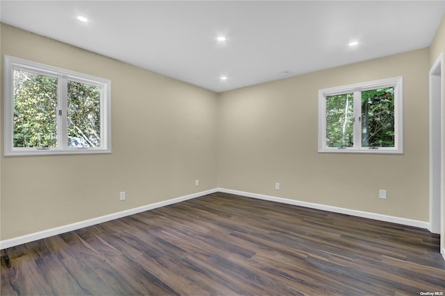 empty room featuring dark wood-type flooring