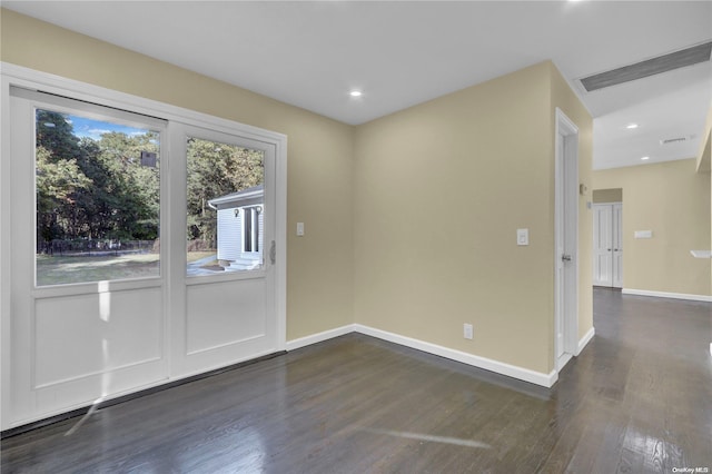 empty room featuring dark hardwood / wood-style floors