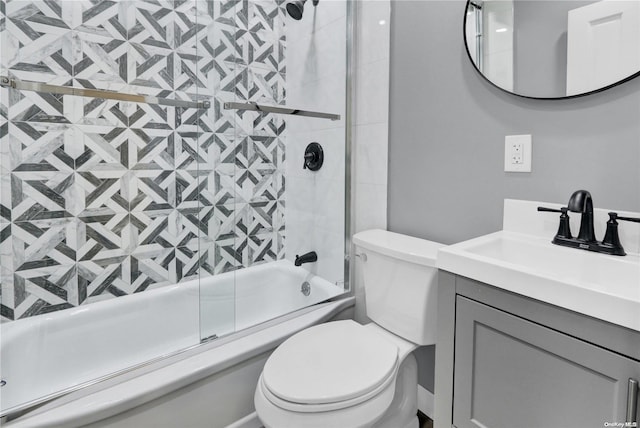 full bathroom featuring vanity, toilet, and enclosed tub / shower combo