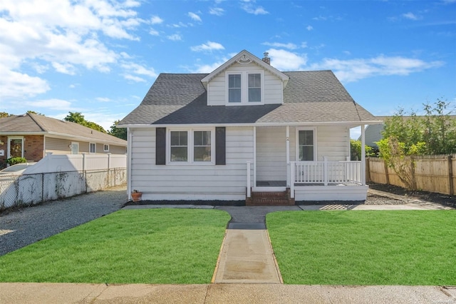 view of front facade featuring a front lawn and a porch