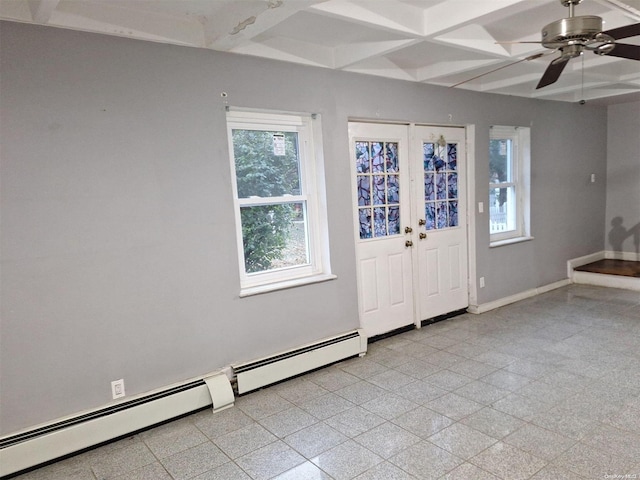 entrance foyer with ceiling fan and a baseboard heating unit