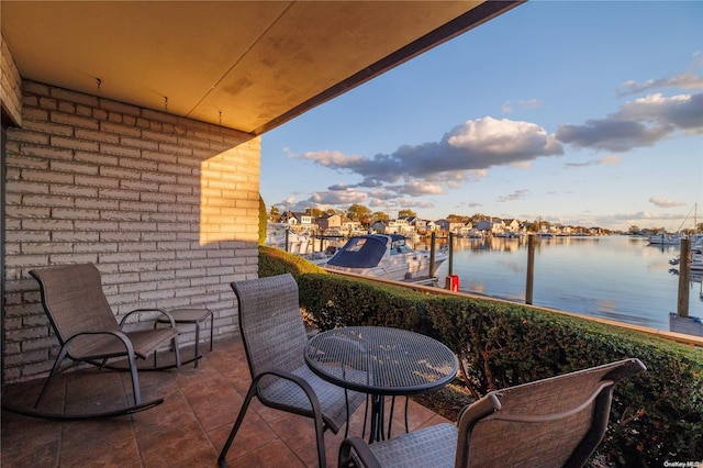 balcony featuring a water view