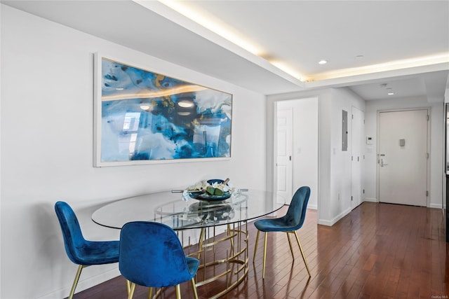 dining space featuring electric panel and dark hardwood / wood-style floors