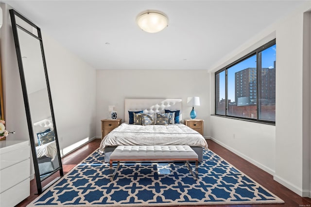 bedroom featuring dark wood-type flooring