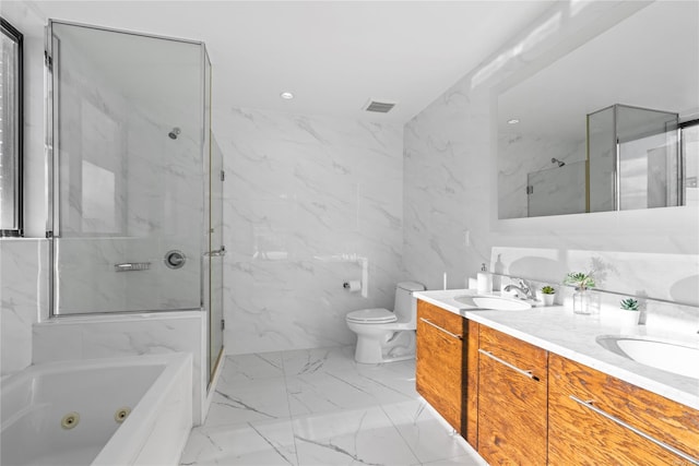 full bathroom with vanity, toilet, tile walls, and independent shower and bath