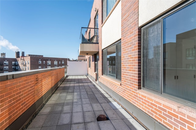 view of patio with a balcony