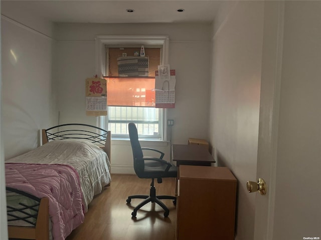 bedroom with light hardwood / wood-style flooring