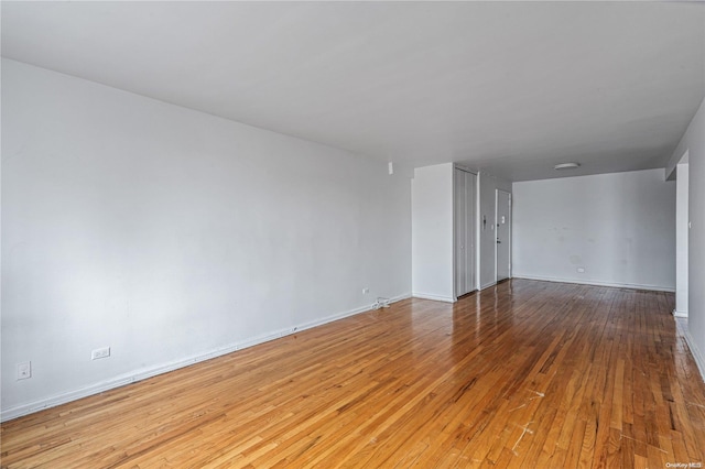 spare room featuring light wood-type flooring