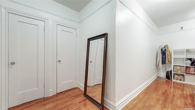 hallway with light wood-type flooring