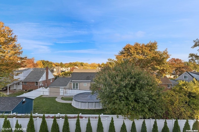 view of yard with a fenced in pool