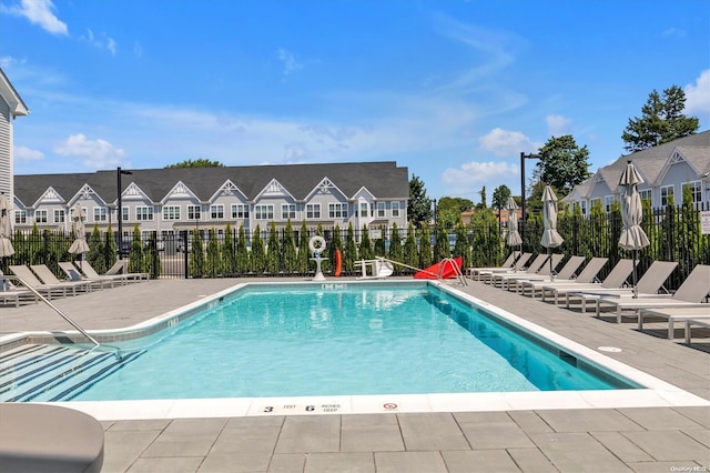 view of swimming pool featuring a patio