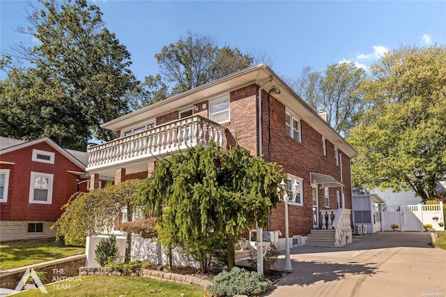 view of front of property with a balcony