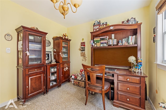 carpeted office space with an inviting chandelier