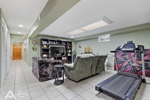 exercise room featuring light tile patterned flooring