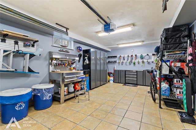 garage featuring a workshop area and a garage door opener