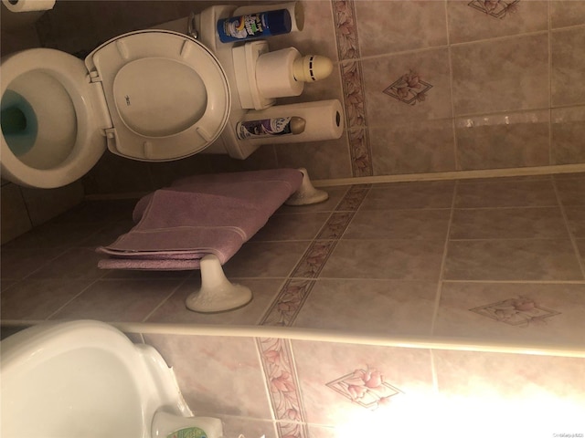 bathroom with tile patterned flooring and toilet