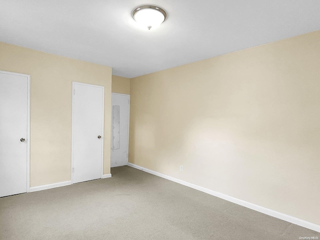 unfurnished bedroom with a closet and carpet