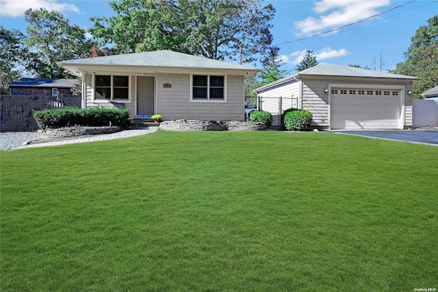 ranch-style home with a front yard and a garage