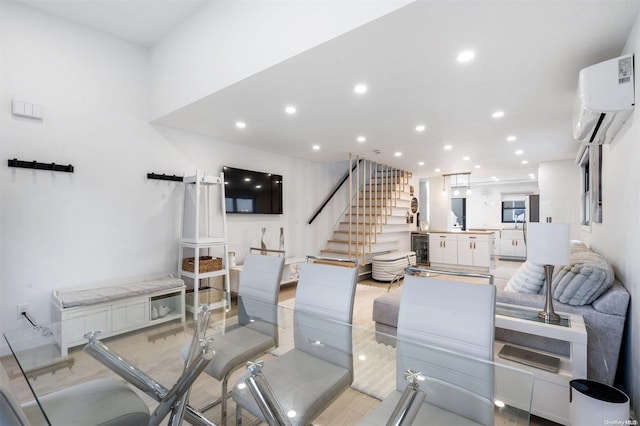 dining area featuring wine cooler and a wall mounted AC