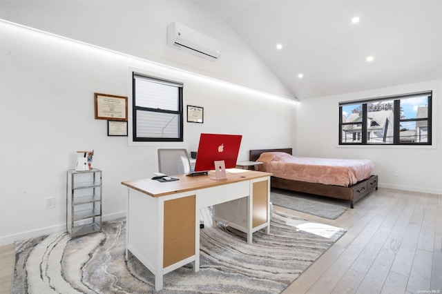 bedroom with a wall mounted AC, high vaulted ceiling, and light hardwood / wood-style floors