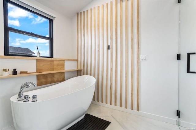 bathroom with a bathtub and lofted ceiling