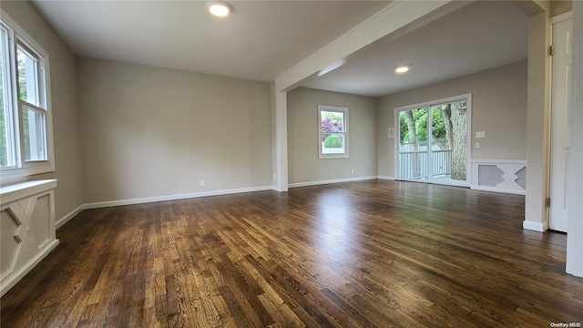 spare room featuring dark hardwood / wood-style floors