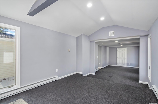 interior space featuring dark colored carpet, lofted ceiling, and a baseboard radiator