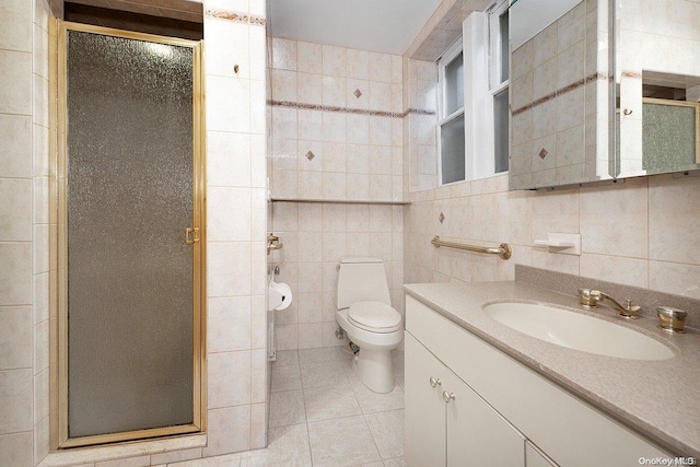 bathroom featuring backsplash, an enclosed shower, vanity, tile walls, and toilet