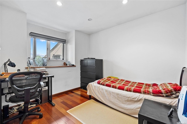 bedroom with hardwood / wood-style flooring