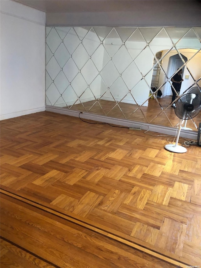 unfurnished room with parquet flooring